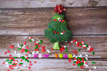 Christmas tree made from broccoli, on a wooden background, close-up, selective focus.2022,2023