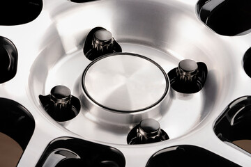 black nuts on the alloy wheel hub close-up