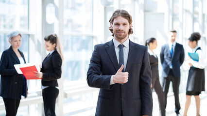 Business man in front of colleagues