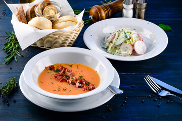 Side view of a two course meal, served on a wooden table
