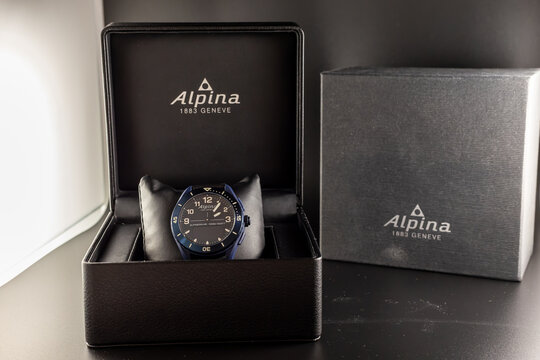 Frankfurt, Germany - November20th 2021: A german photographer unboxes his new hybrid watch Alpina AlpinerX Alive and takes pictures of it and the box and equipment.