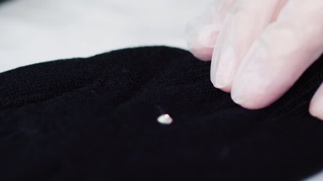 Close up view. Rhinestone gloves with pretty stones into a snowflake pattern.