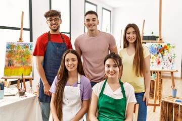 Group of five hispanic artists at art studio with a happy and cool smile on face. lucky person.