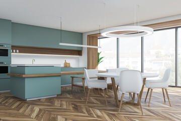 Green and white kitchen space
