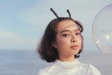 Beautiful Retro space girl holding helmet space.