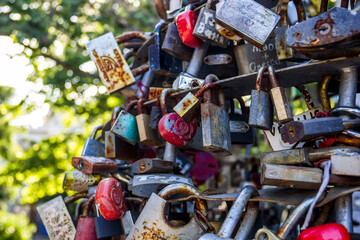 Fototapeta na wymiar closed love locks on the bridge
