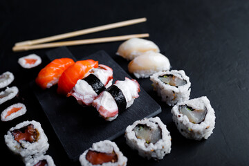 japanese sushi food. Maki ands rolls with tuna, salmon, shrimp, crab and avocado. Top view of assorted sushi.