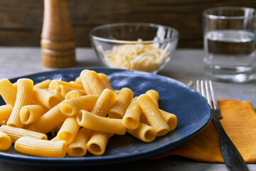 Plate of macaroni italian pasta on a concrete surface