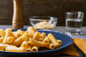  Plate of macaroni italian pasta on a concrete surface