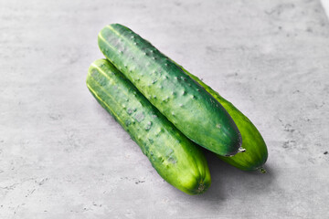  Bunch of cucumbers on a marble surface
