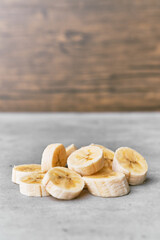 Photo of banana slices on a concrete surface