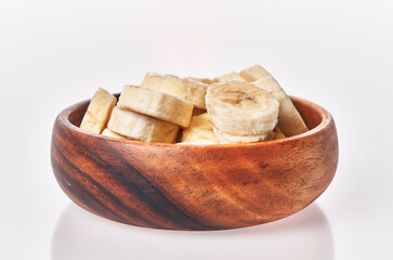  Bowl of slices of banana isolated on a white background