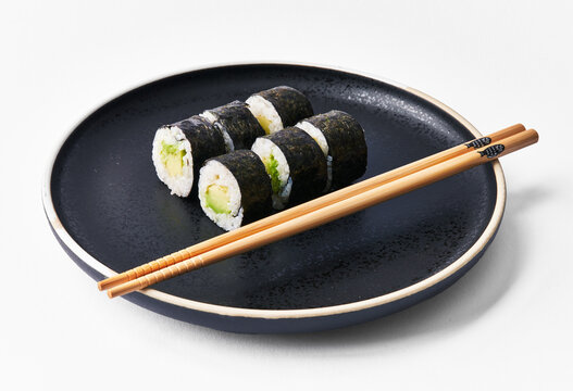  Plate of avocado sushi makis isolated on white background
