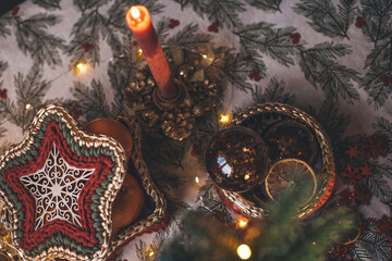 Christmas decor on the dining table candles tree oranges