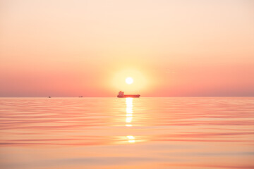 Vibrant pink and orange sunset at the sea