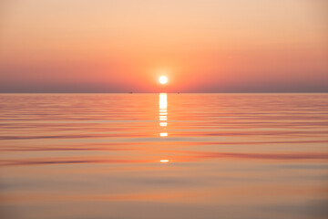 Vibrant pink and orange sunset at the sea