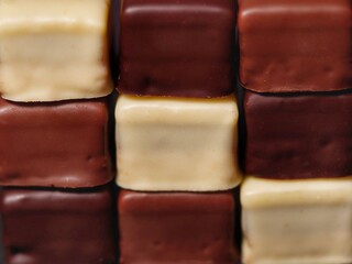 Dominos stacked up with 3 different chocolates