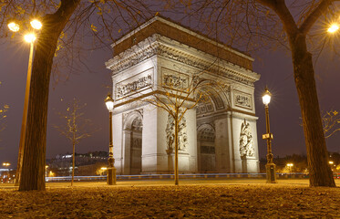 The Triumphal Arch in rainy evening, Paris, France.
