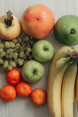 Composition with Summer Colorful Fresh Fruits on Wooden White Background