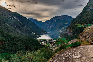 Scenic view on beautiful Geiranger fjord, town and Norwegian mountains