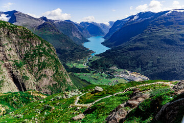 Fototapeta na wymiar Scenic view on beautiful fjord, town and Norwegian mountains