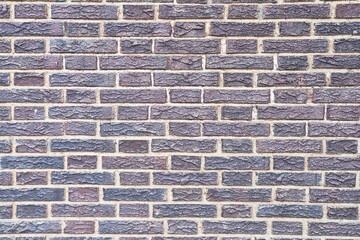 Brick wall texture with cracked tiles and cement. Classic brickwall surface background
