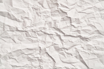 White crumpled paper texture with wrinkles. Damaged and torn sheet