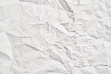 White crumpled paper texture with wrinkles. Damaged and torn sheet