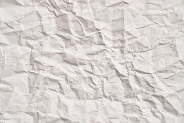 White crumpled paper texture with wrinkles. Damaged and torn sheet