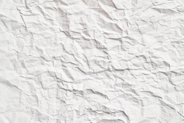 White crumpled paper texture with wrinkles. Damaged and torn sheet