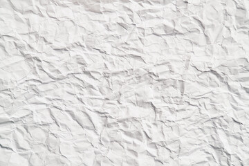 White crumpled paper texture with wrinkles. Damaged and torn sheet