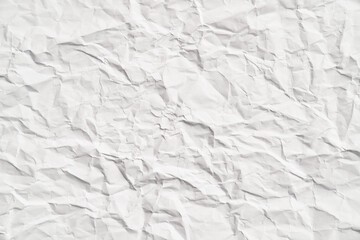 White crumpled paper texture with wrinkles. Damaged and torn sheet