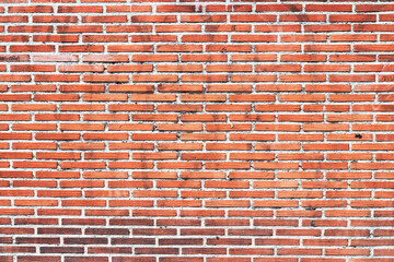 Brick wall texture with cracked tiles and cement. Classic brickwall surface background