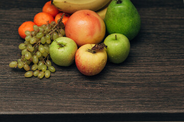 Fruits Composition Close Up With Water Droplets on the Peel with Copy Space