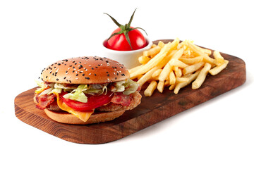 Burger with chicken cutlet, fried bacon and vegetables, French fries, on a wooden board, white background, no people, horizontal,
