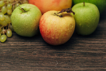 Composition with Summer Colorful Fresh Fruits on Wooden Brown Background