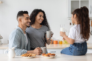 Obraz na płótnie Canvas Cheerful family having breakfast together at home