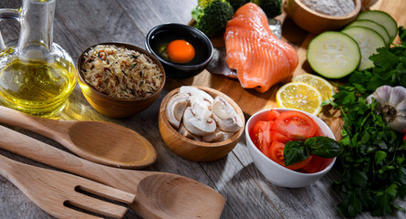 Fresh food ingredients prepared for cooking on a kitchen table