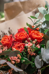 Close-up of a bouquet of roses on a blurred background.