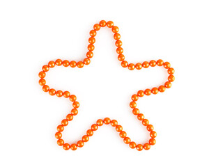 Orange beads  lying in the shape of a star isolated on white background with shadow, top view, close-up. Decorative element, Christmas star.