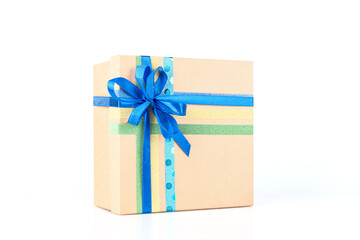 Square gift cardboard box with blue ribbon on white background isolated, close-up, front view. Boxing day.