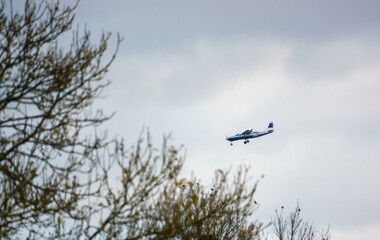 Cessna 208b Grand Caravan G-CPSS light aircraft returning to land after dropping army parachutists over Netheravon airfield Wiltshire UK