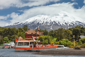Landscape of the Osorno volcano and pier to visit the Todos los Santos lake (All Saints lake), in...