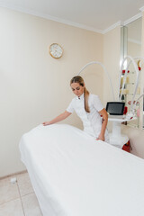 Rejuvenating facial skin treatment, correction of wrinkles. The doctor is standing in the office...