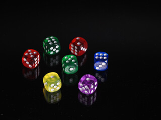 Colored Dice on a black background