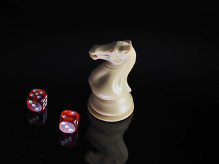 White Knight Chess piece with red dice for gaming