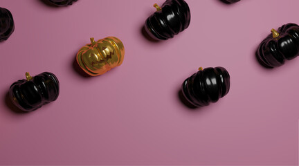 horizontal image of golden pumpkin surrounded by black, halloween concept, top view on pink background with place for design