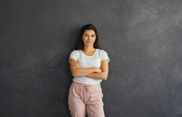 Portrait of millennial girl isolated on black studio background show leadership qualities. Smiling young Caucasian woman intern or employee worker look at camera posing. Employment concept.