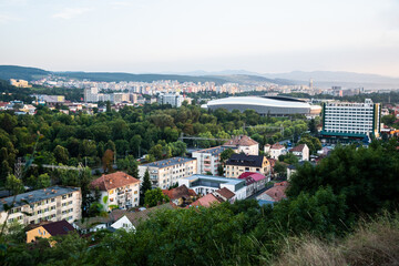 Fototapeta na wymiar Aerial view over the city with the Cluj Arena stadium, central park and Grand Hotel Napoca. Cluj Napoca, Romania.