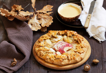 Whole wheat gallet with apple and pear, served with coffee. Rustic style.